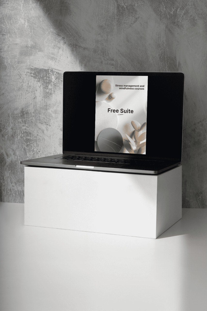 Laptop on a white stand with a gray concrete wall background
