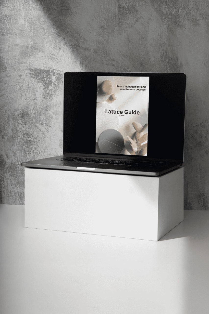 Laptop with a screen displaying a document on a white surface against a gray wall.
