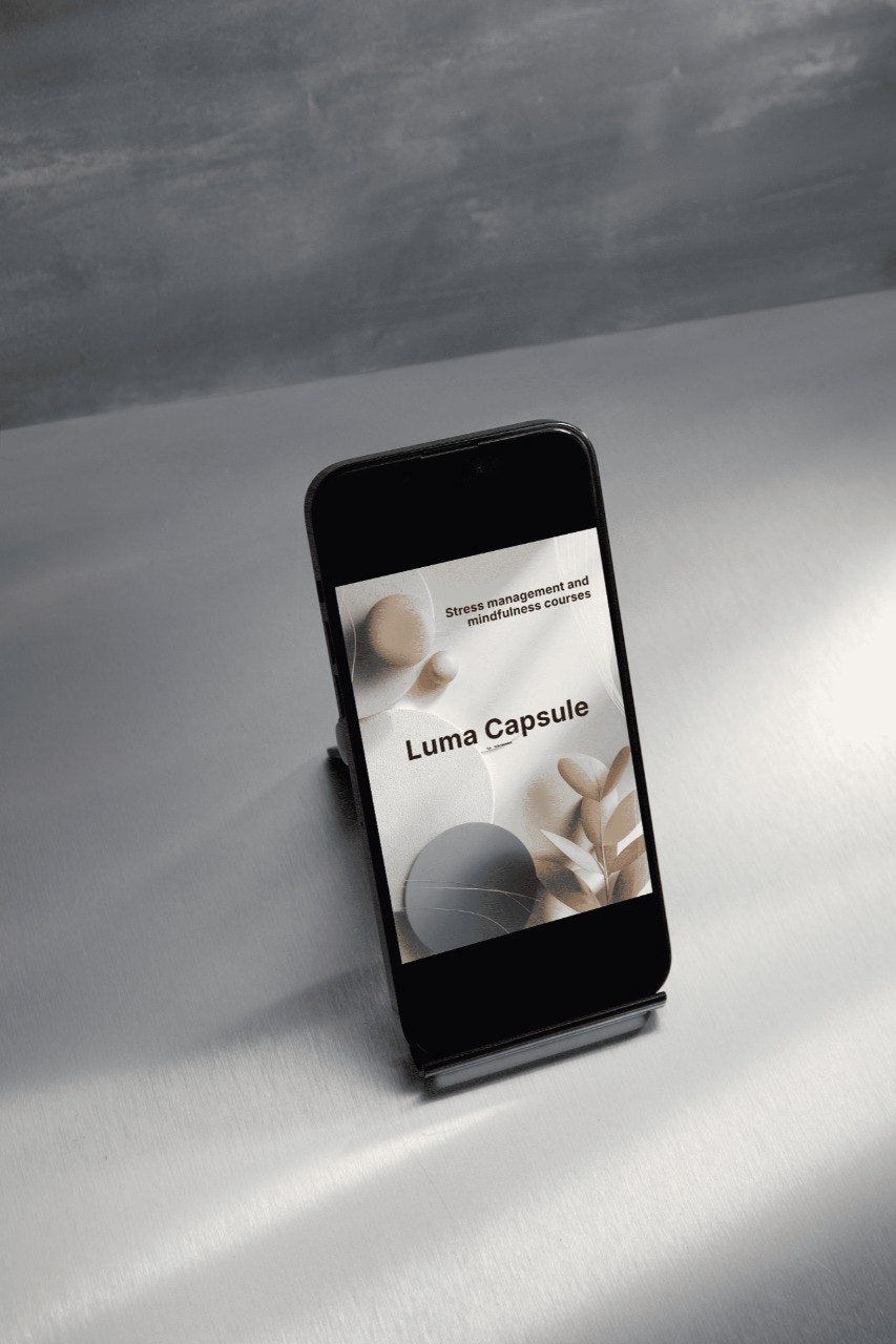 Smartphone displaying 'Luma Capsule' on a gray surface