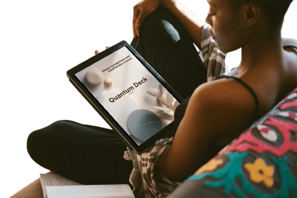 Person holding a tablet with 'Quantum Deck' displayed on the screen, sitting on a white background
