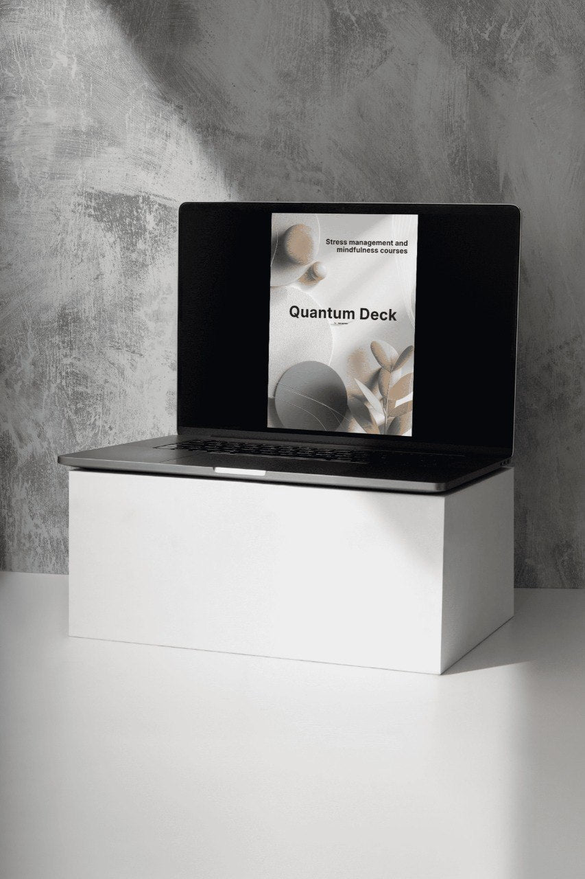 White electronic device with a black screen displaying 'Quantum Deck' on a gray surface.